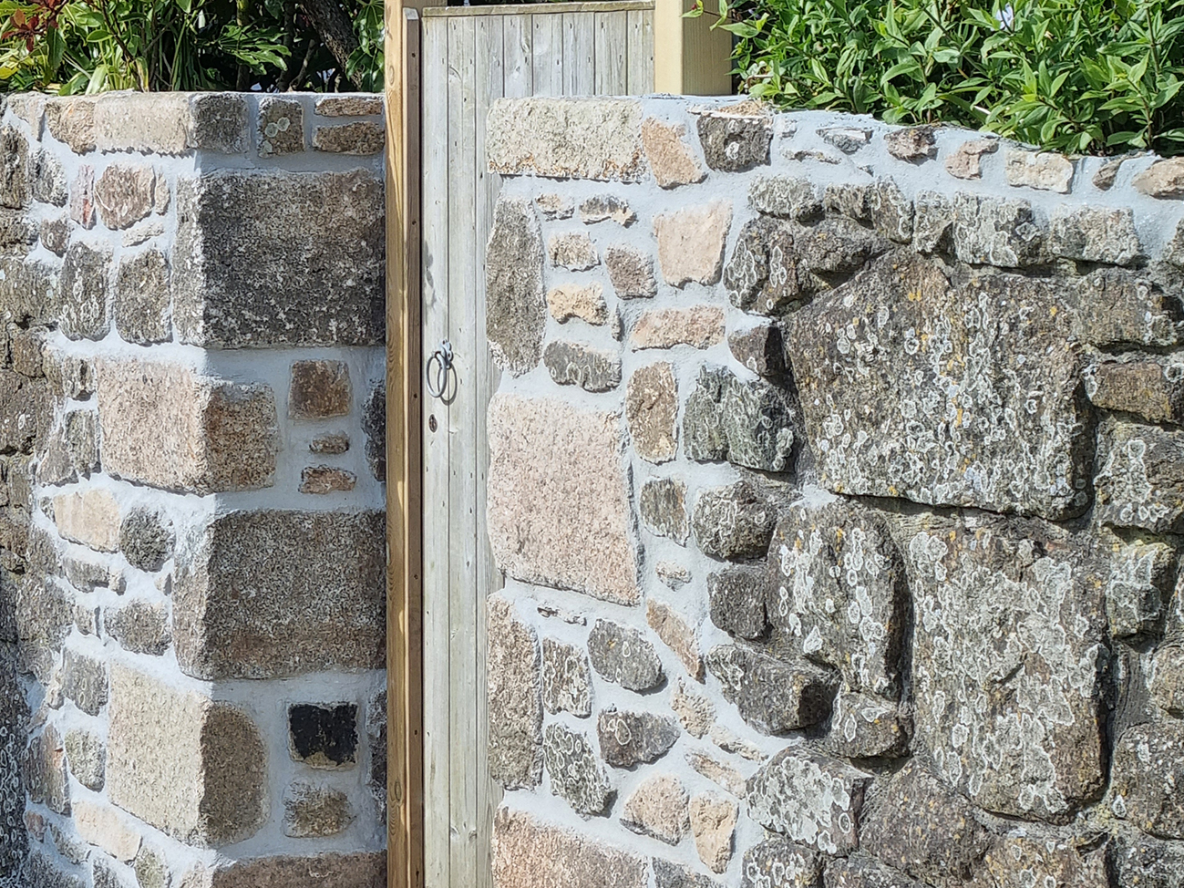 Masonry repairs to a traditional stone wall near Penzance
