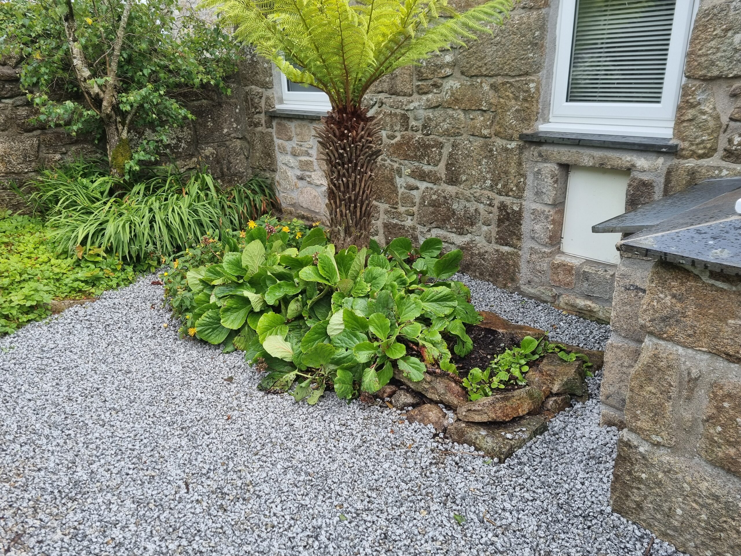 Gravel driveway and traditional stone masonry at West Cornwall property, near Penzance