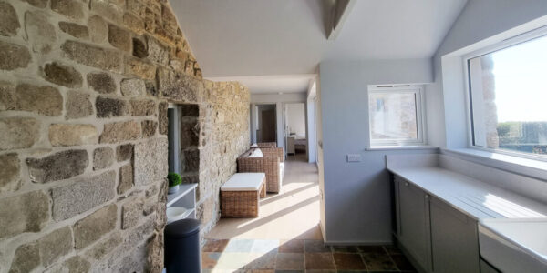 Interior renovation of property in Cornwall with exposed traditional stone wall